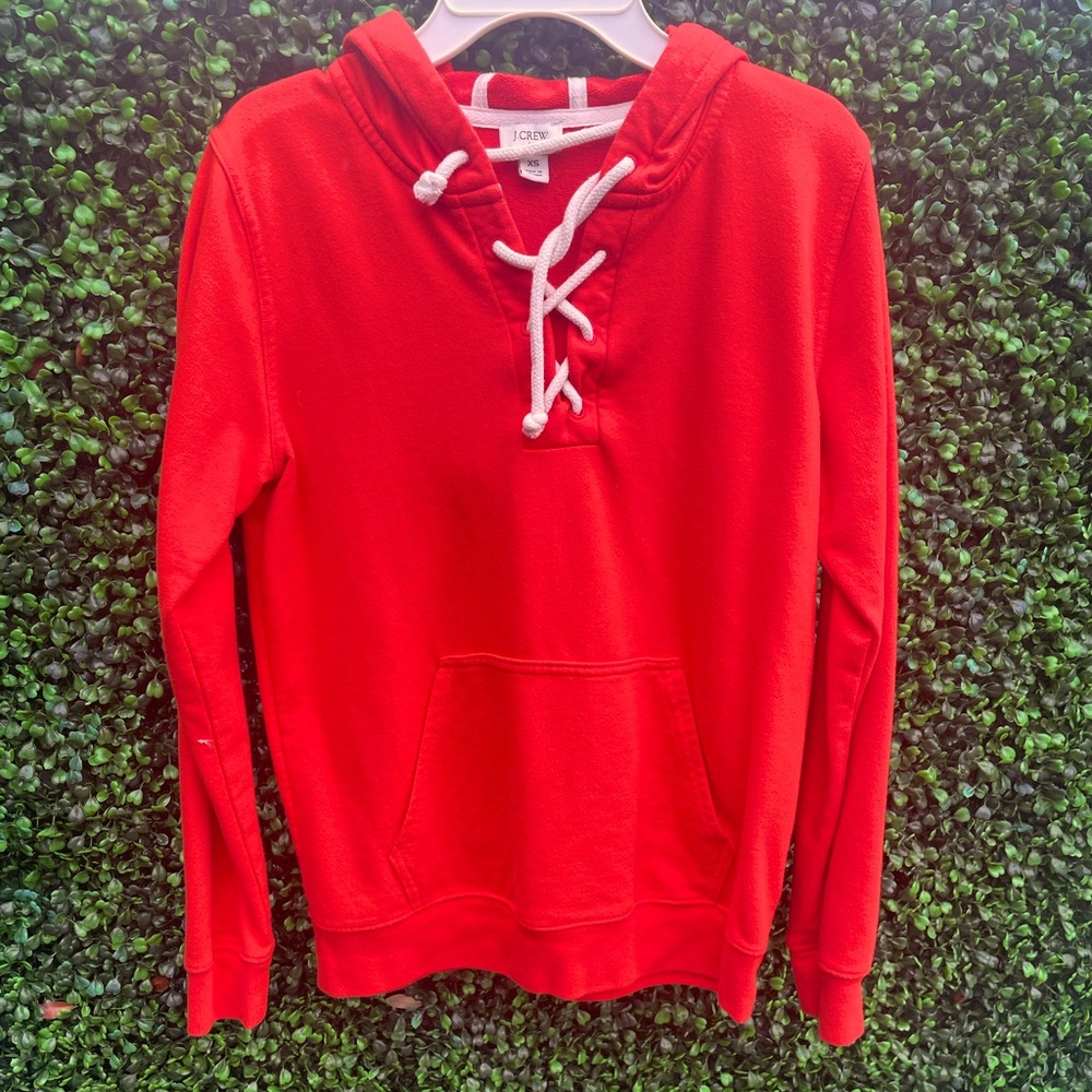 Orange woman’s J.Crew sweater